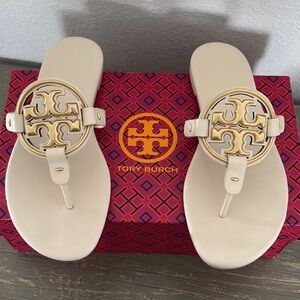 Tory Burch Cream T-Strap Sandals with Gold Medallion